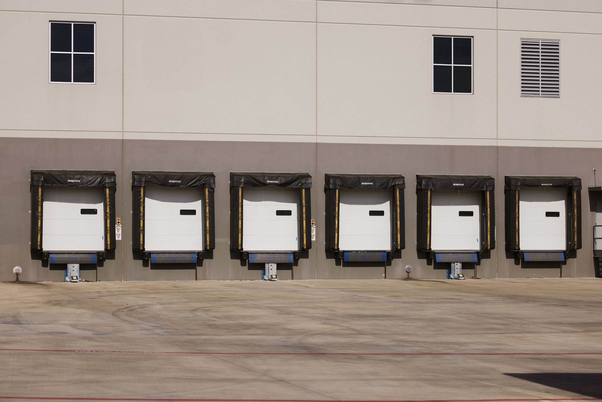 Industrial Loading Dock Area Showcasing Shipping Bay Doors and Warehouse Exterior