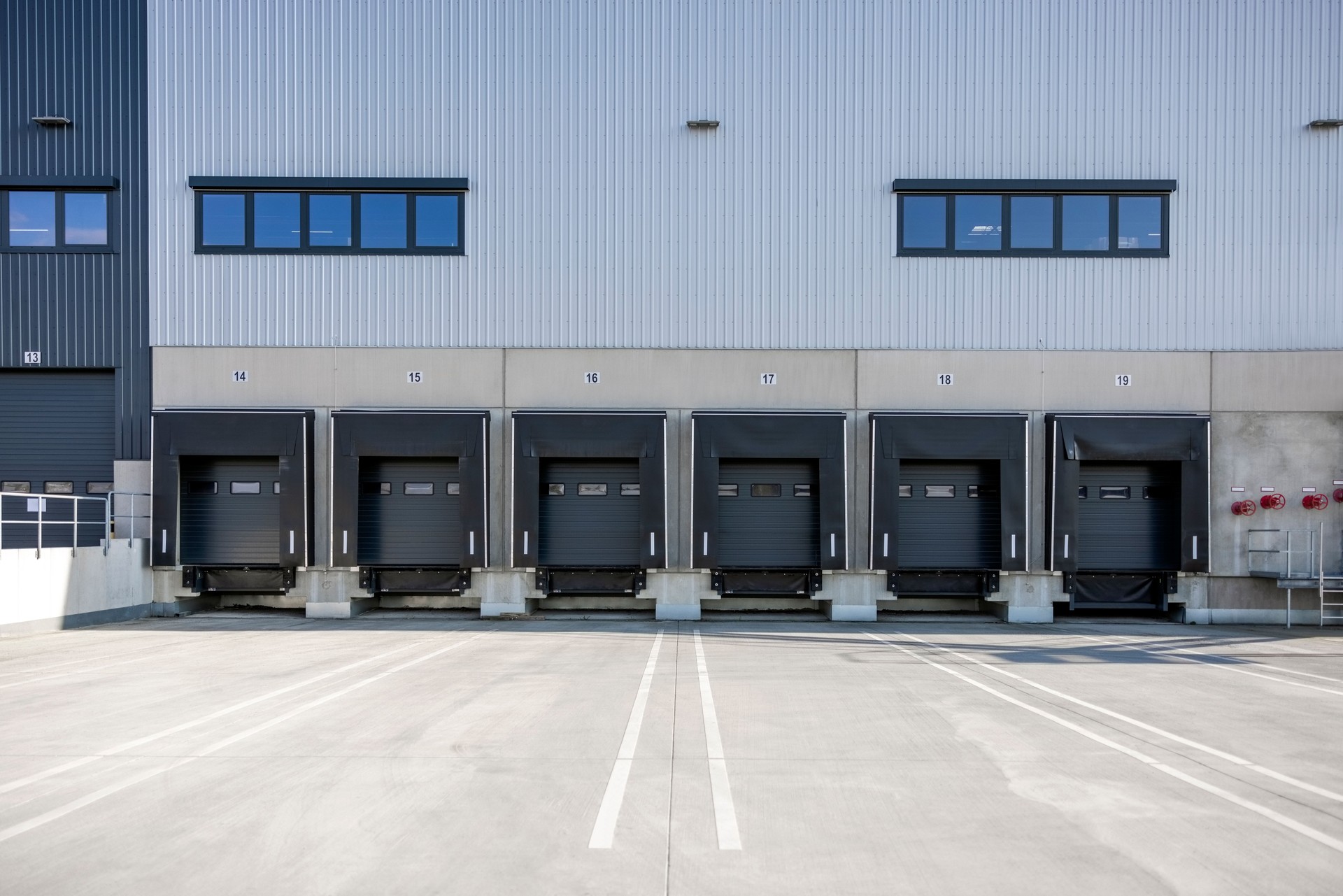 Loading bays at large distribution warehouse with shutter doors